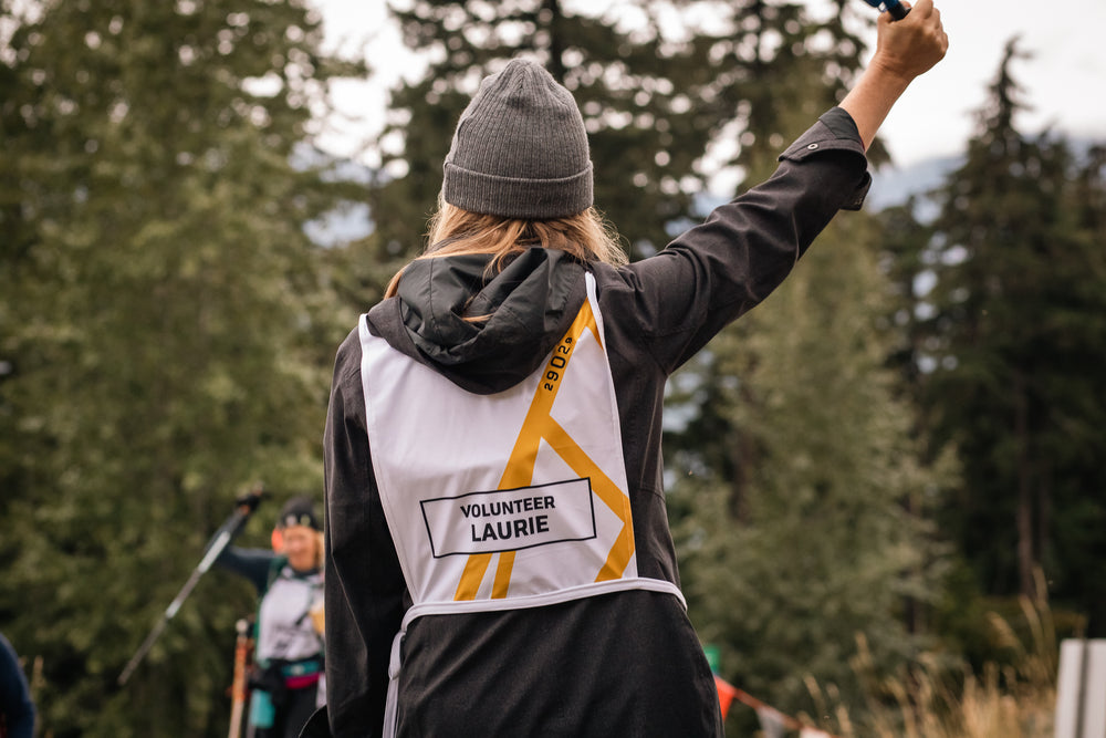 Volunteer and climber fist bump on mountain