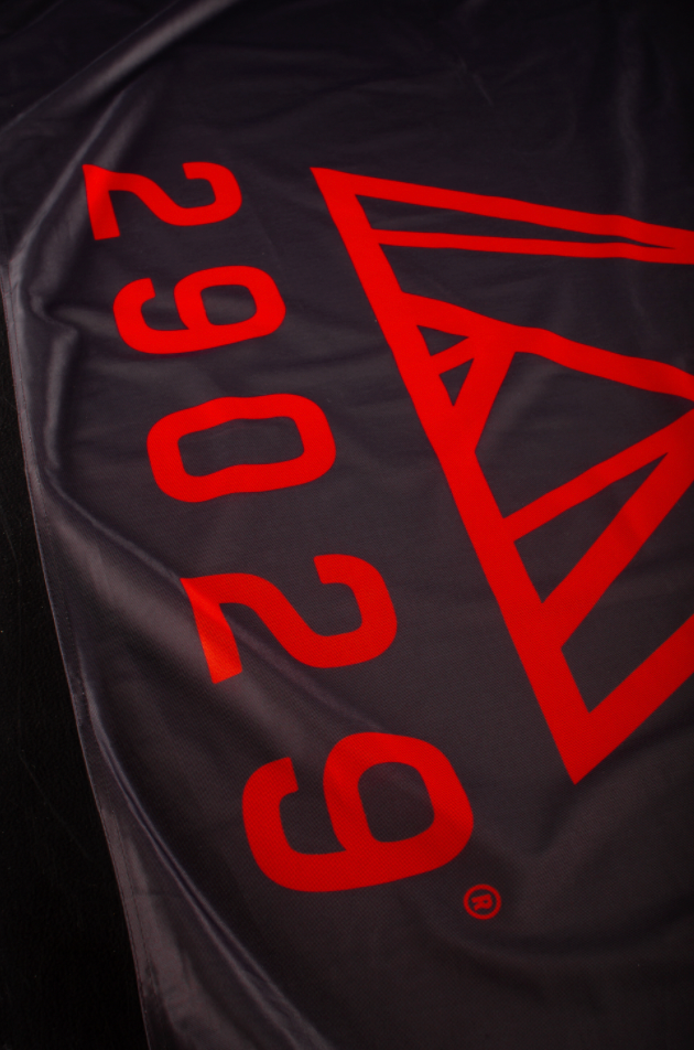 29029 flags in red with black logo or black flag with red logo.